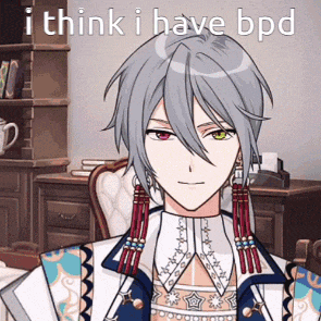 a man with gray hair is sitting in front of a desk with the words i think i have bpd