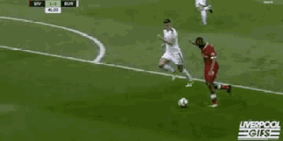 a soccer goalie is jumping to catch a soccer ball in a liverpool gifs video