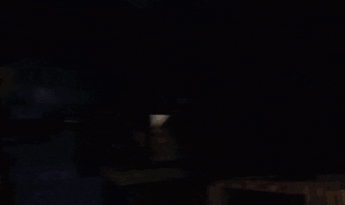 a cartoon drawing of a man holding a torch in a dark room