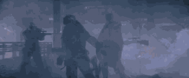 a silhouette of batman holding a sword in the fog