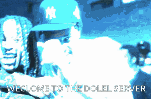 a man in a new york yankees hat is holding a gun next to another man with dreadlocks