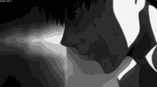a close up of a person 's face in a black and white photo .