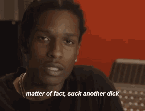 a close up of a man 's face with the words matter of fact suck another dick below it