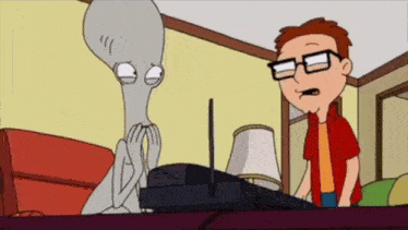 a cartoon of a man standing next to a gray alien with glasses .