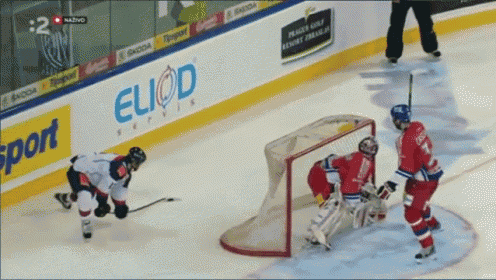 a hockey game is being played in front of a banner that says euod