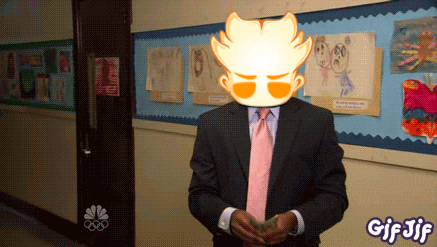 a man in a suit and tie is standing in a hallway with a nbc logo on the wall