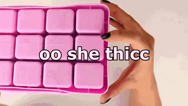 a woman is holding a pink ice cube tray with the words oo she thicc on it .