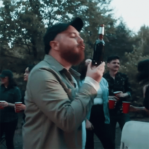 Kissing A Bottle Of Beer Alex Melton GIF - Kissing A Bottle Of Beer Alex Melton Beer Never Broke My Heart Song GIFs