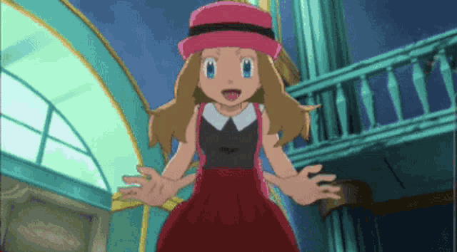 a girl in a red dress and pink hat is standing in front of a building