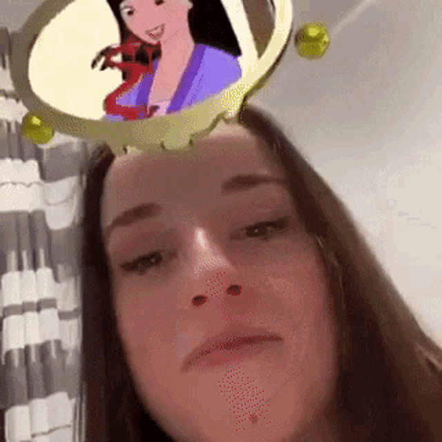 a woman with a cartoon of mulan on her head