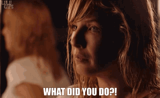 a woman is looking at herself in the mirror and says what did you do