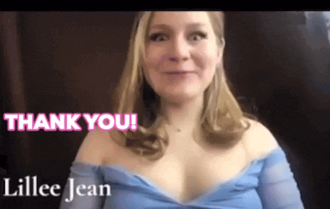 a woman in a blue dress says thank you in pink letters