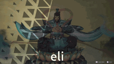 a statue of a man sitting on a lotus flower with the word eli written below him