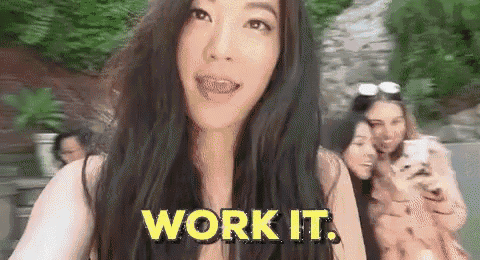 a woman is taking a selfie with the words `` work it '' written above her .