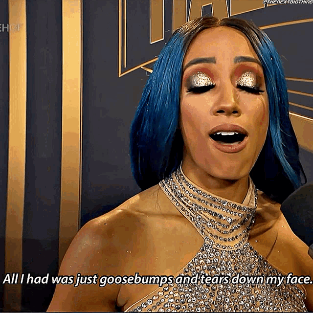 a woman with blue hair is talking about goosebumps and tears down her face