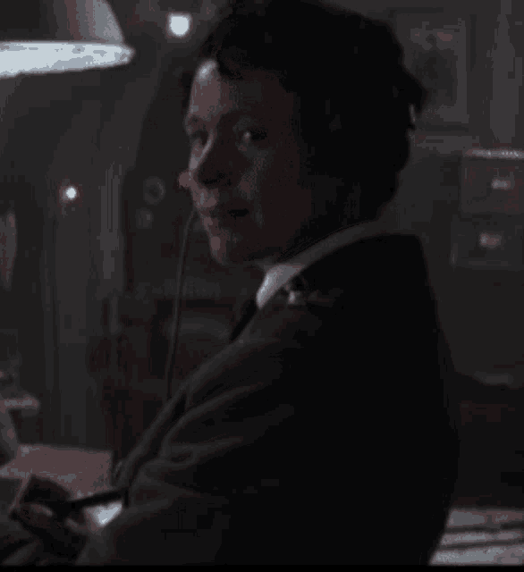 a man wearing a headset is making a funny face