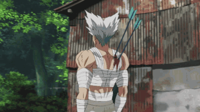 a man with an arrow in his back is standing in front of a building
