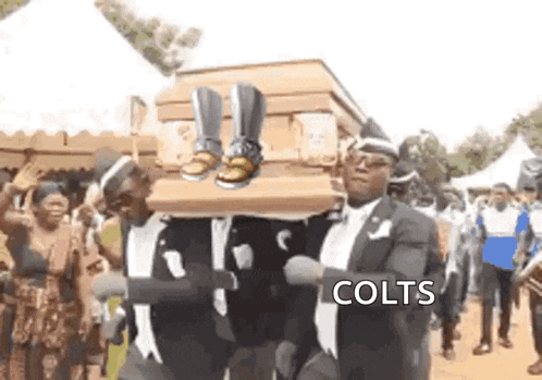 a man is carrying a coffin with a pair of boots on top of it .