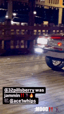 a red car is parked on a wooden deck with the caption 32pillsberry was jamming