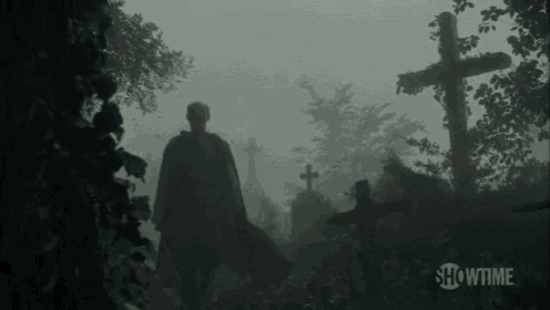 a man in a cape is walking through a cemetery with showtime written on the bottom right