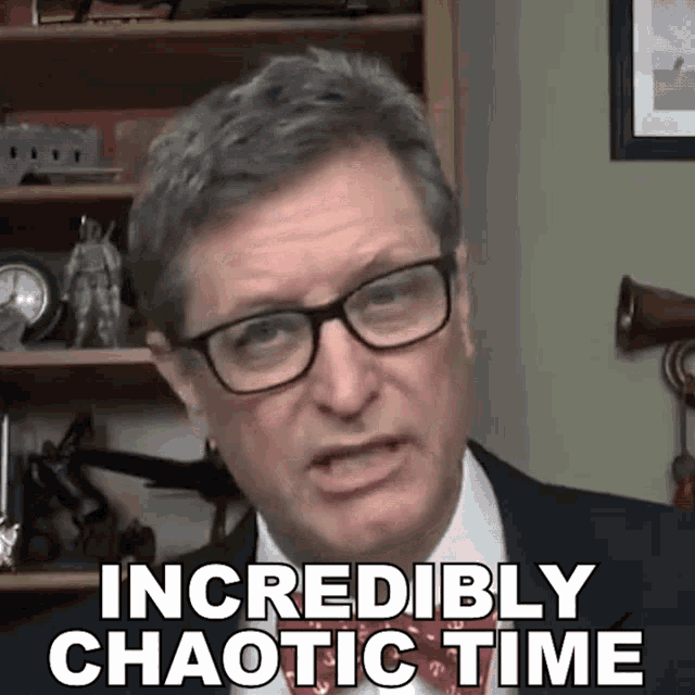 a man wearing glasses and a bow tie says incredibly chaotic time