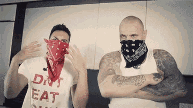 a man wearing a bandana and a shirt that says eat