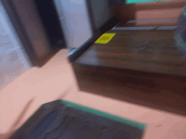 a wooden box with a yellow sticker on it that says " no "