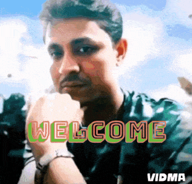 a man 's face is displayed with the words welcome behind him