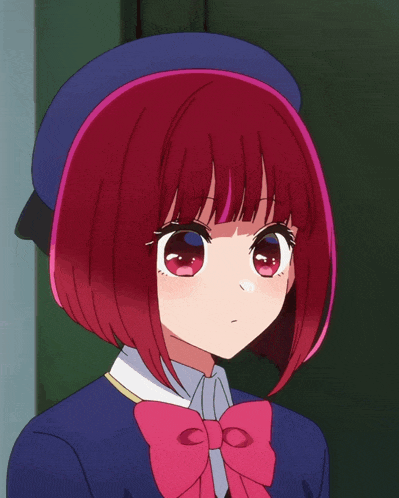 a girl with red hair wearing a blue hat and a pink bow