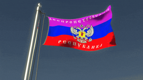 a red blue and purple flag with a coat of arms on it