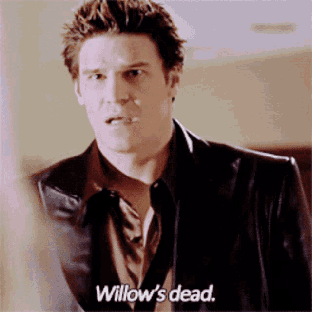 a man in a suit says willow 's dead in a close up