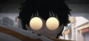a close up of a person 's face with big eyes .
