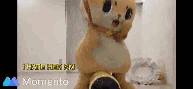 a stuffed animal with the words i hate her sm on the bottom