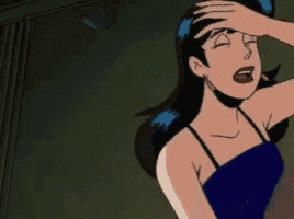 a woman in a blue dress is laying on the ground with her mouth open