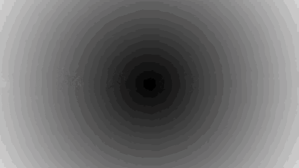 a gray background with a black circle in the middle