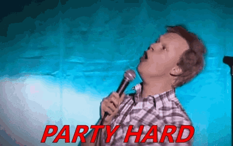 a man is singing into a microphone with the words party hard written in red