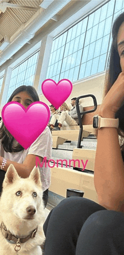 a woman sitting next to a dog with the word mommy written on the bottom