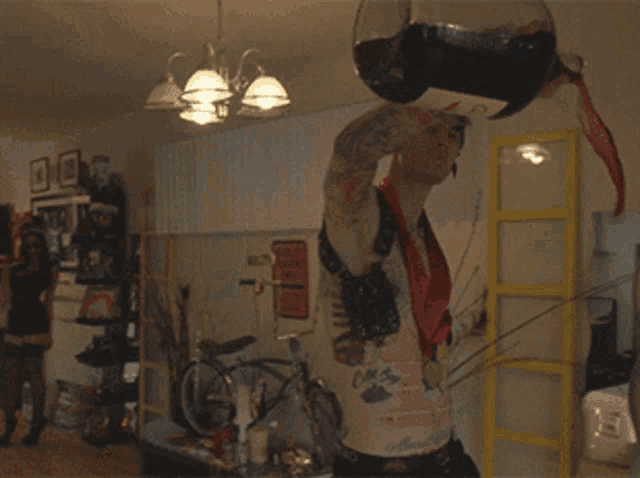 a man is pouring a bottle of coke into a glass