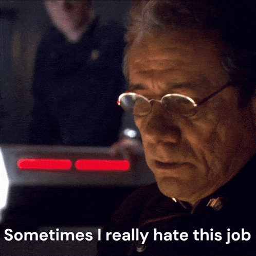 an older man wearing glasses says " sometimes i really hate this job "