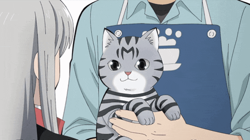 a person holding a cat with the letter m on its face