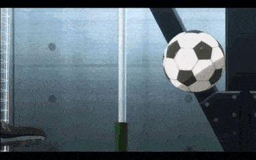 a soccer ball is going through a fence with a stool in the foreground
