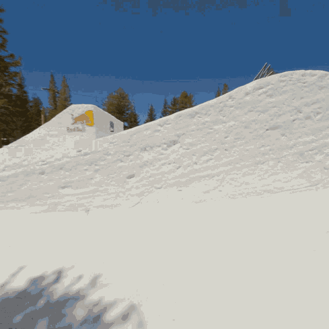 a snowboarder is doing a trick in the air