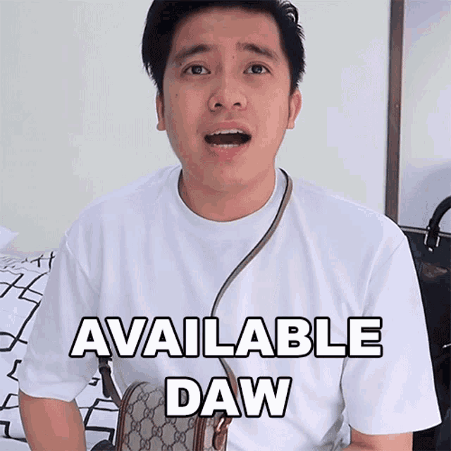 a man wearing a white shirt with the words available daw on it