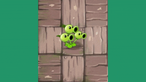 a group of green plants with their mouths open are standing next to each other on a wooden surface .
