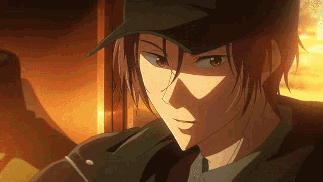 a close up of a man wearing a baseball cap