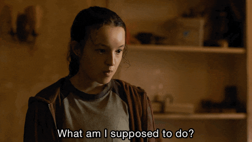 a girl says " what am i supposed to do " in front of a shelf