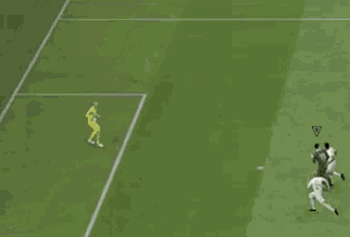 a soccer game is being played on a green field