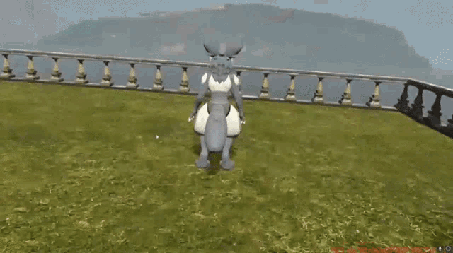 a person is petting a gray and white furry character