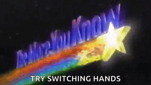 a sign that says " try switching hands " with a rainbow behind it