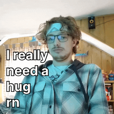 a man wearing glasses and a bandage on his head says " i really need a hug rn "